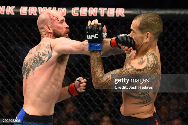 Donald Cerrone punches Yancy Medeiros in their welterweight bout during the UFC Fight Night event at Frank Erwin Center on February 18, 2018 in...