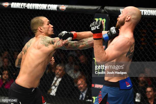 Yancy Medeiros punches Donald Cerrone in their welterweight bout during the UFC Fight Night event at Frank Erwin Center on February 18, 2018 in...