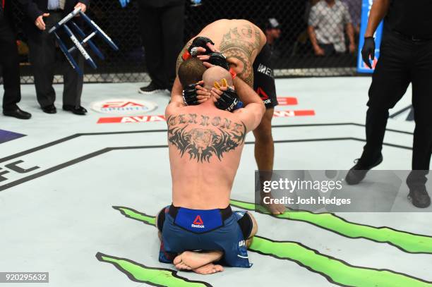 Yancy Medeiros congratulates Donald Cerrone after their welterweight bout during the UFC Fight Night event at Frank Erwin Center on February 18, 2018...