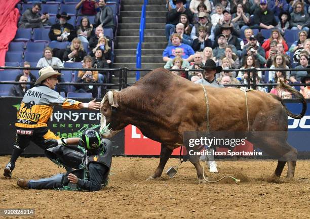 Matador tries to protect rider Wallace Vieira de Oliveira from the bull Get Smoked during round two of the Professional Bull Riders St. Louis...