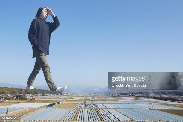giant walking through the country side - giantess stock pictures, royalty-free photos & images