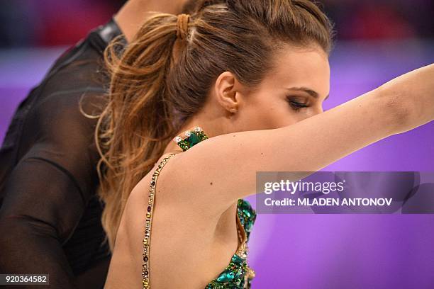 France's Guillaume Cizeron performs with France's Gabriella Papadakis after the back fastening of her costume came undone duing the ice dance short...