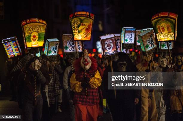 Revellers parade with lanterns during the traditional "Morgestreich" procession starting the carnival of Basel on February 19, 2018. The three-day...