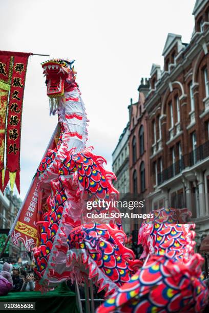 Chinese tributional dragon dance being performed in Chinatown. Londoners gather in London's chinatown and trafalgar square to celebrate Chinese new...