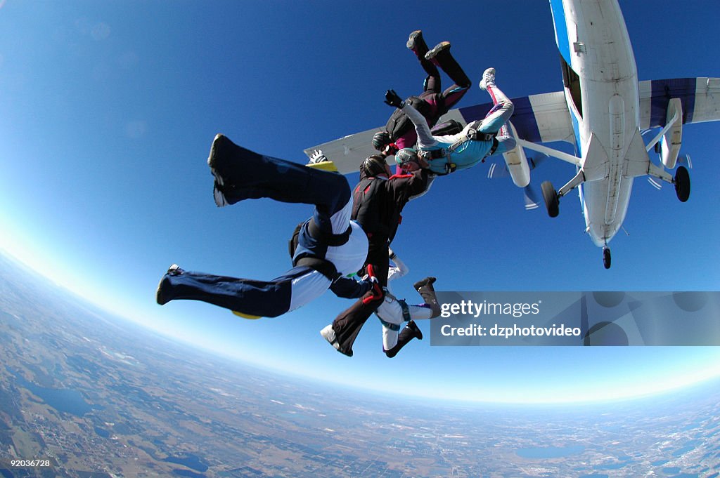 Royalty Free Stock Photo: Group Skydiving - Otter Exit