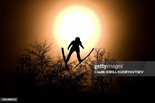 Italy's Alessandro Pittin flies through the sun disk during the nordic combined men's individual Gundersen LH/10km official training 3 at the...