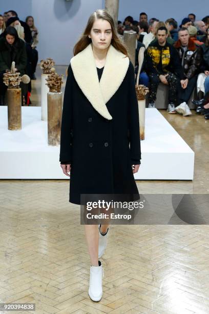 Model walks the runway at the JW Anderson show during London Fashion Week February 2018 at University of Westminster on February 16, 2018 in London,...