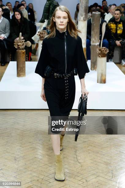 Model walks the runway at the JW Anderson show during London Fashion Week February 2018 at University of Westminster on February 16, 2018 in London,...