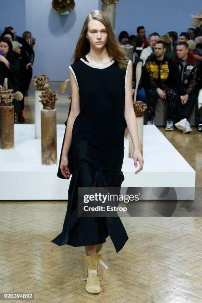 Model walks the runway at the JW Anderson show during London Fashion Week February 2018 at University of Westminster on February 16, 2018 in London,...