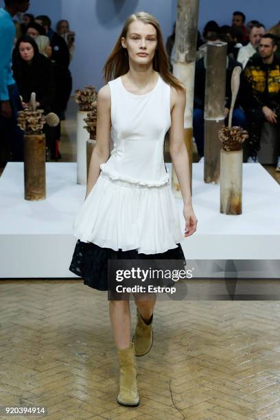 Model walks the runway at the JW Anderson show during London Fashion Week February 2018 at University of Westminster on February 16, 2018 in London,...