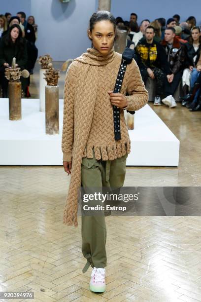 Model walks the runway at the JW Anderson show during London Fashion Week February 2018 at University of Westminster on February 16, 2018 in London,...