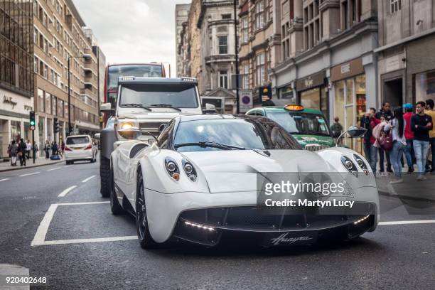 Rally driver and businessman Yazeed al-Rajhi drives his Pagani Huayra round the streets of Knightsbridge closely followed by his security in the...