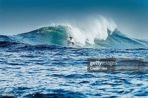 big wave surfers - facing challenge stock pictures, royalty-free photos & images