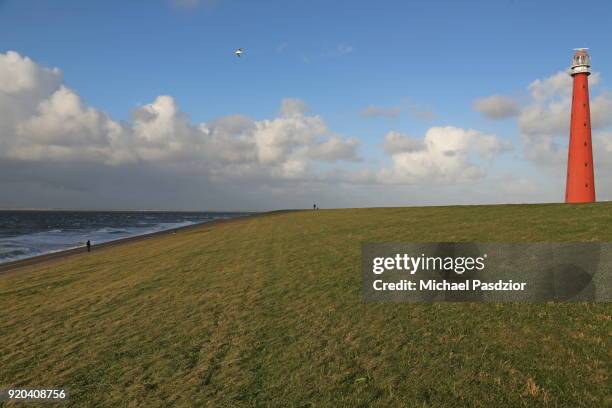 dike at lighthouse lange jaap - den helder stock pictures, royalty-free photos & images