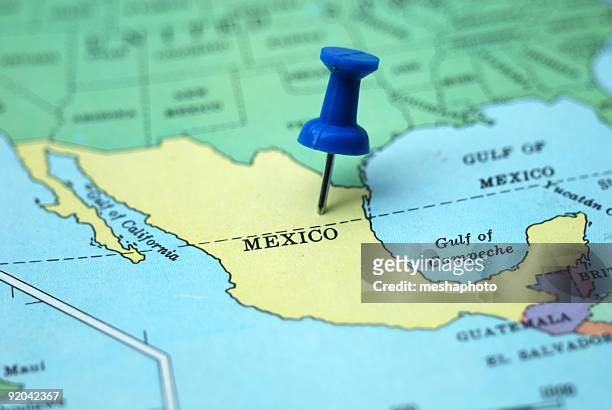 a pushpin marking mexico as a travel destination on a map - mexico map stock pictures, royalty-free photos & images