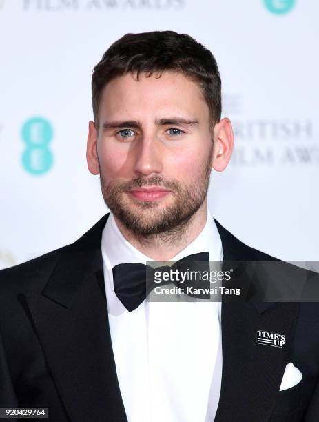Edward Holcroft poses in the press room during the EE British Academy Film Awards held at the Royal Albert Hall on February 18, 2018 in London,...