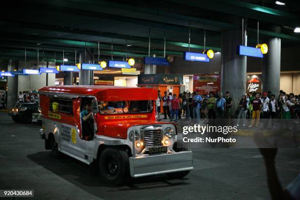 Jeepney filled with passengers leaves a loading bay in Manila, Philippines on Thursday, February 1, 2018. The Jeepney has become a symbol of Filipino...