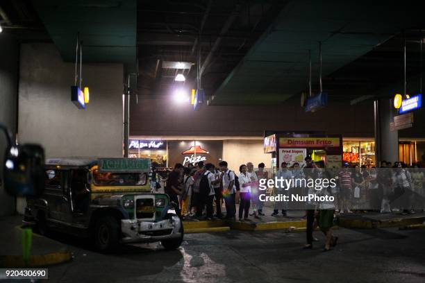 Jeepney stands idle, as commuters fall in line at a loading bay in Manila, Philippines on Thursday, February 1, 2018. The Jeepney has become a symbol...