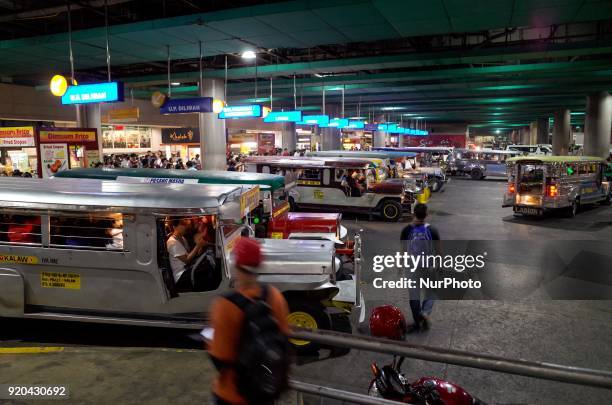 Fleets of jeepneys are seen at a loading bay in Manila, Philippines on Thursday, February 1, 2018. The Jeepney has become a symbol of Filipino...