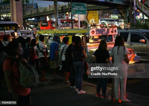 Commuters wait for an empty jeep in Manila, Philippines on Friday, February 3, 2018. The Jeepney has become a symbol of Filipino culture through the...