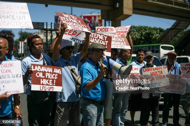 Jeepney drivers belonging to the activist jeepney driver group PISTON hold a protest against the Philippine government's jeepney phaseout program in...