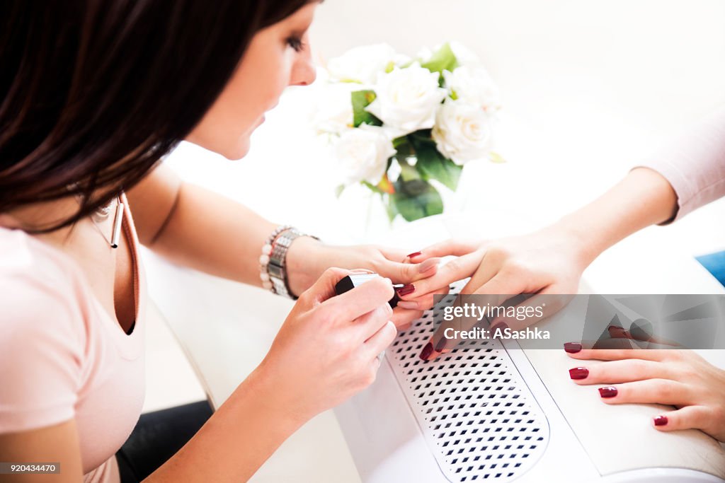 Woman getting a manicure