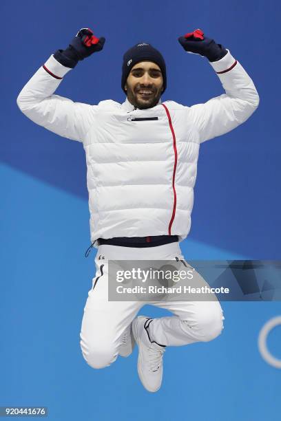 Gold medalist Martin Fourcade of France celebrates during the medal ceremony for the Biathlon - Men's 15km Mass Start on day 10 of the PyeongChang...