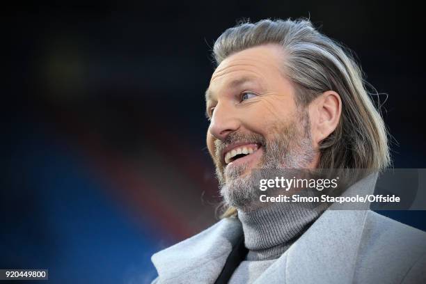 Robbie Savage looks on during The Emirates FA Cup Fifth Round match between Huddersfield Town and Manchester United at the John Smith's Stadium on...