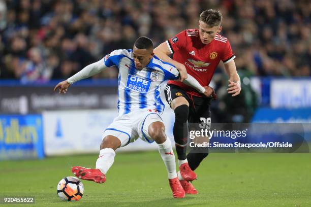 Rajiv van La Parra of Huddersfield battles with Scott McTominay of Man Utd during The Emirates FA Cup Fifth Round match between Huddersfield Town and...