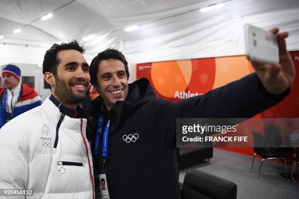 France's biathlon double gold medallist Martin Fourcade poses for a selfie with Paris 2024 president Tony Estanguet backstage at the Athletes' Lounge...