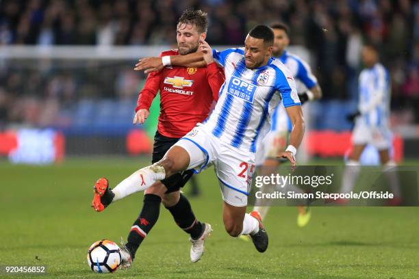 Mathias Zanka Jorgensen of Huddersfield battles with Luke Shaw of Man Utd during The Emirates FA Cup Fifth Round match between Huddersfield Town and...