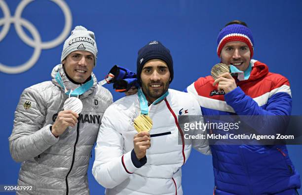 Simon Schempp of Germany wins the silver medal, Martin Fourcade of France wins the gold medal, Emil Hegle Svendsen of Norway wins the bronze of the...