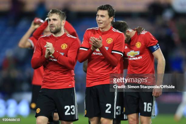 Luke Shaw of Man Utd walks off alongside teammate Victor Lindelof at the end of The Emirates FA Cup Fifth Round match between Huddersfield Town and...