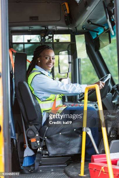 school bus driver looking through doorway - bus driver stock pictures, royalty-free photos & images