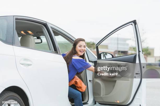 teenage girl, passenger looking out car door - open day 14 stock pictures, royalty-free photos & images