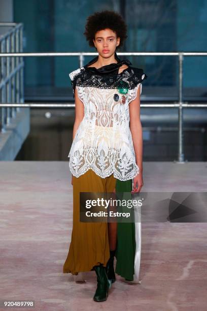 Model walks the runway at the Toga show during London Fashion Week February 2018 on February 17, 2018 in London, England.