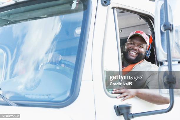 african-american truck driver in driver's seat - trucker's hat stock pictures, royalty-free photos & images