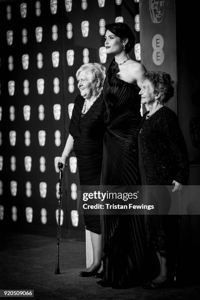 Gemma Arteton poses with the original Dagenham ladies Eileen Pullen and Gwen Davis as they attend the EE British Academy Film Awards held at Royal...