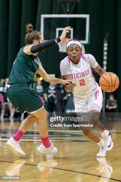 Cleveland State Vikings forward Ashanti Abshaw is defended by Green Bay Phoenix guard Jen Wellnitz during the third quarter of the women's college...