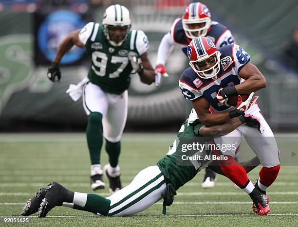 Lito Sheppard of The New York Jets tackles Lee Evans of The Buffalo Bills during their game on October 18, 2009 at Giants Stadium in East Rutherford,...