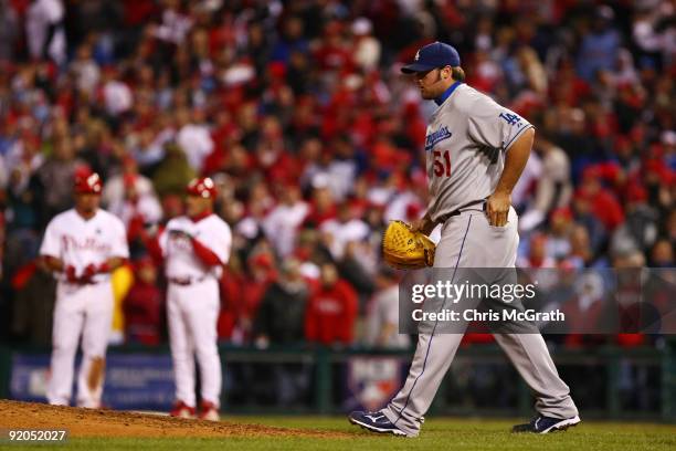 Jonathan Broxton of the Los Angeles Dodgers walks back to the mound after he hit Carlos Ruiz of the Philadelphia Phillies with a pitch in the bottom...