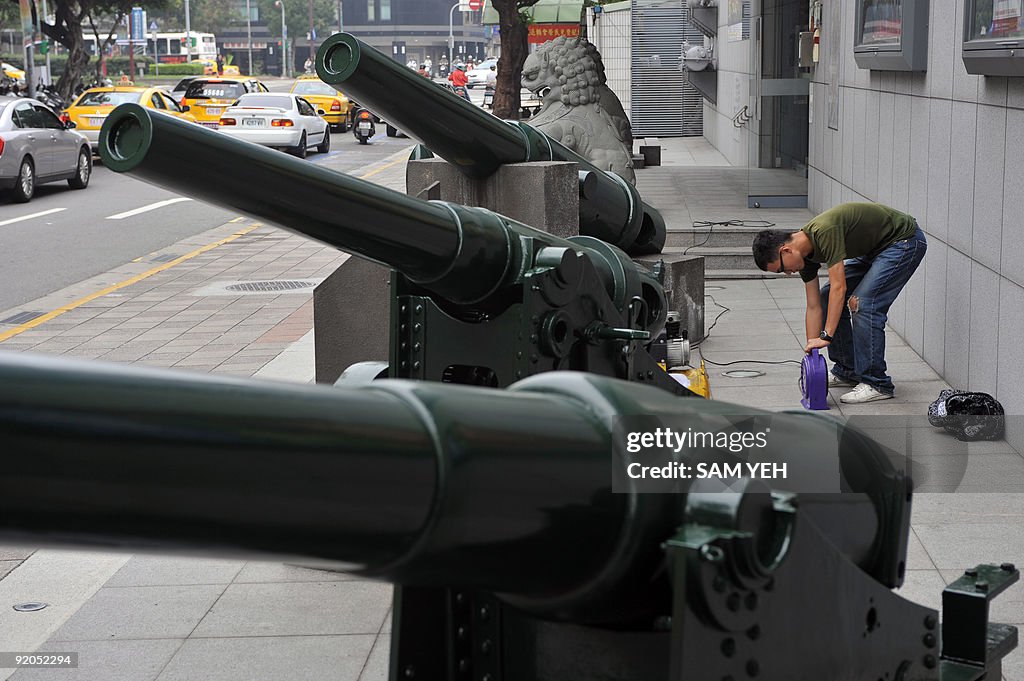 A serviceman works beside 1887 UK-made A