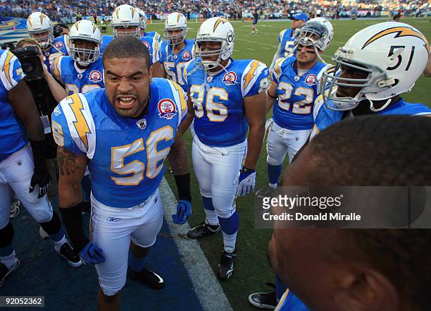 Linebacker Shawn Merriman of the San Diego Chargers leads the team in a cheer before the start of the game against the Denver Broncos during Monday...