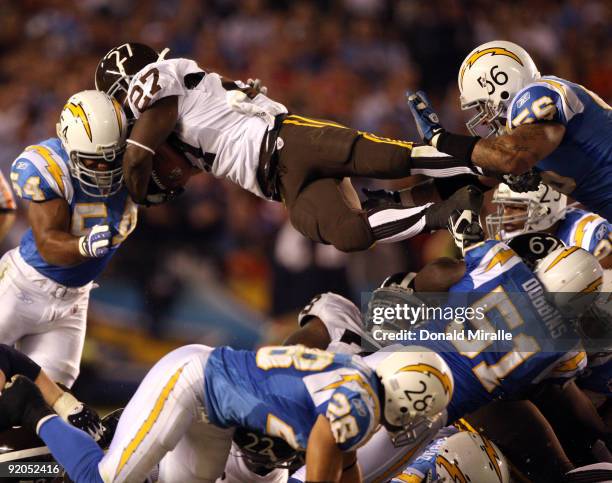 Runningback Knowshon Moreno of the Denver Broncos goes up for the first down against the San Diego Chargers during Monday Night Football on October...