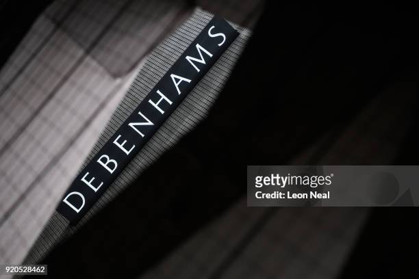The company logo is seen on the exterior of a branch of the Debenhams chain of department stores on Oxford Street on February 19, 2018 in London,...
