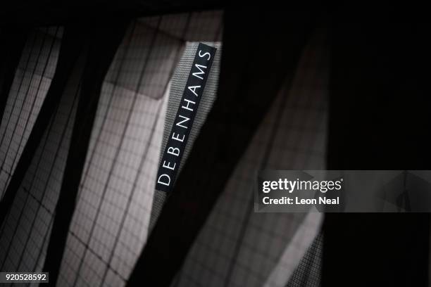 The company logo is seen on the exterior of a branch of the Debenhams chain of department stores on Oxford Street on February 19, 2018 in London,...