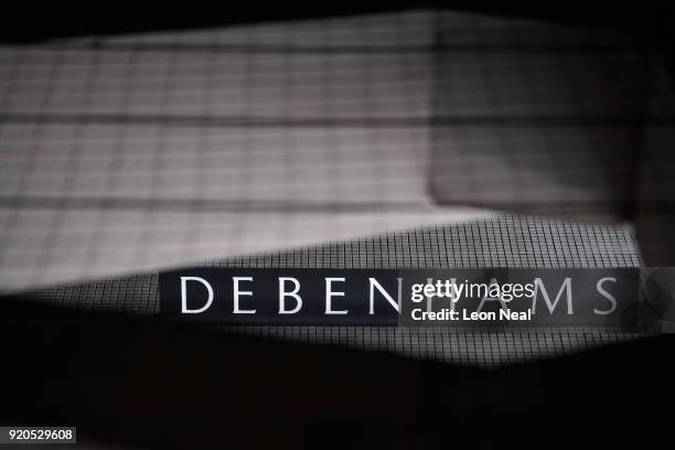 The company logo is seen on the exterior of a branch of the Debenhams chain of department stores on Oxford Street on February 19, 2018 in London,...