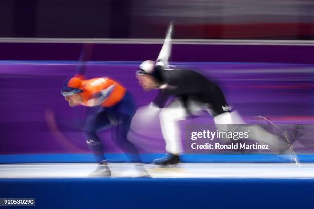 Jan Smeekens of the Netherlands and Mitchell Whitmore of the United States compete during the Men's 500m Speed Skating on day 10 of the PyeongChang...