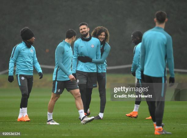 Olivier Giroud is embraced by Ethan Ampadu of Chelsea during a training session at Chelsea Training Ground on February 19, 2018 in Cobham, England.