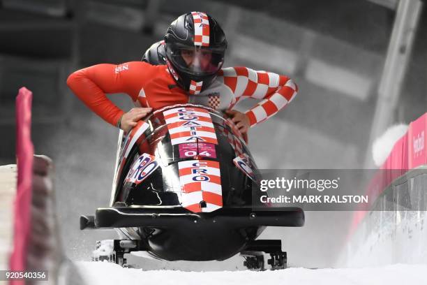 Croatia's Benedikt Nikpalj and Drazen Silic slow down at the end of the 2-man bobsleigh heat 3 run during the Pyeongchang 2018 Winter Olympic Games,...